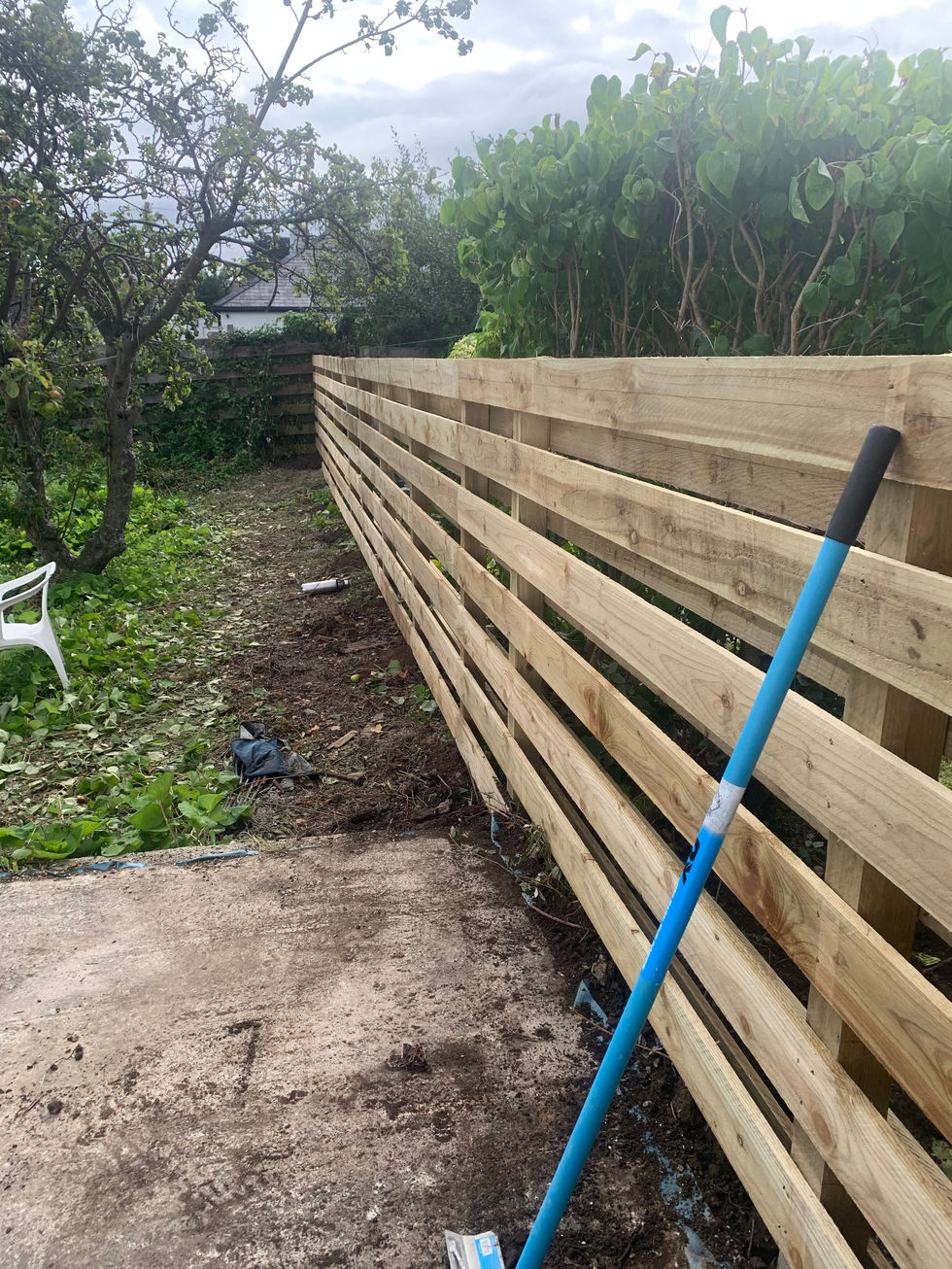 Horizontal timber fence installation in progress – JDM Building Services Isle of Man
