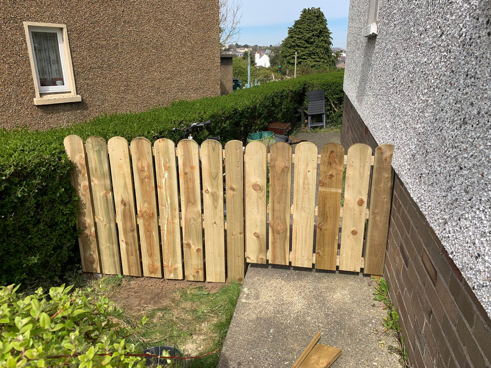 New wooden garden gate with rounded picket-style boards installed – JDM Building Services Isle of Man
