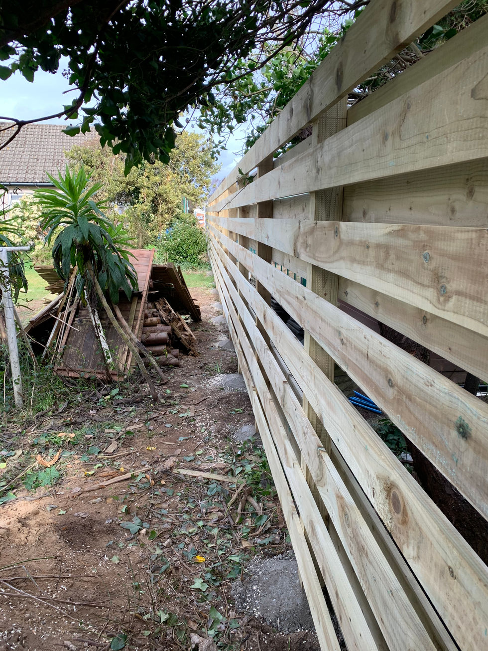 Horizontal timber fence installation close-up view – JDM Building Services Isle of Man