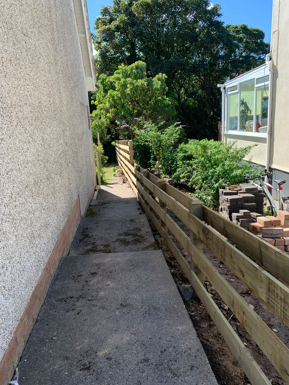 New timber fence fitted along narrow side passage – JDM Building Services Isle of Man