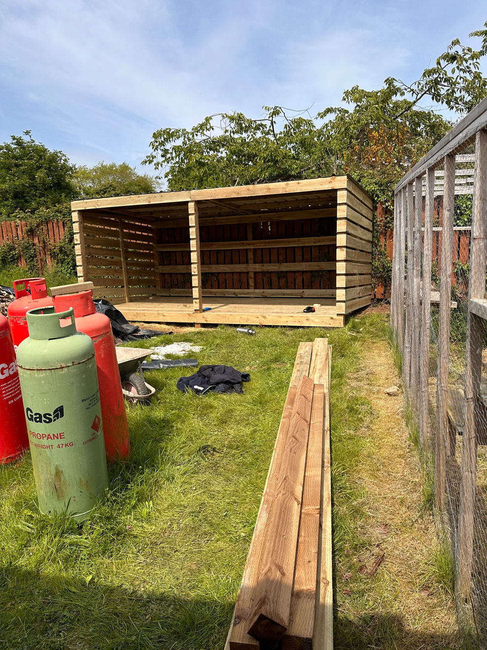 New timber wood shed with additional materials on site – JDM Building Services Isle of Man