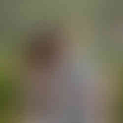 Couple posing together with Silves hillside and rooftops in the background during a portrait session