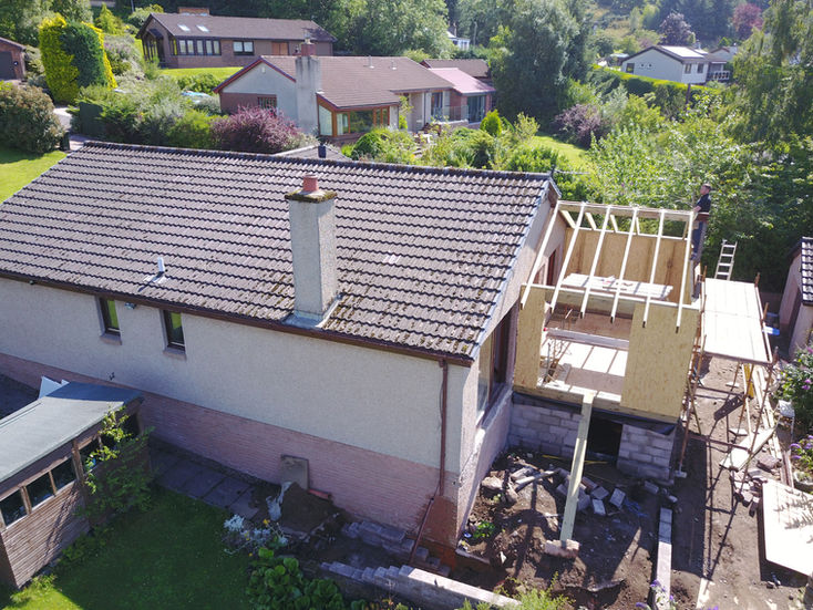 Drone view of roof extension construction project
