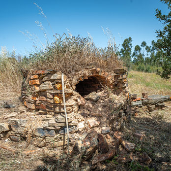 Traditional outdoor oven at a rural off-grid property in Alentejo.

