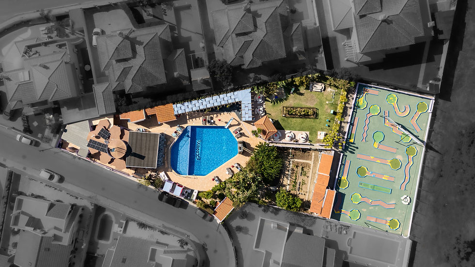 Aerial drone view of Scooby’s Swimming Pool Bar in Galé, showing the pool, bar, restaurant, and mini-golf layout.