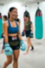 all smiles during muay thai class at pineapple mma in singapore