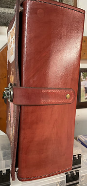 Right side of PAul's binder showing incomplete closure strap without the carry handle