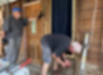 (L-R) Frank Smith and Tom Elliott helping repair the home of Ms. Rose Woods in Schulenburg.