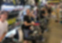 Image of Game-Set-Match staff working on stringing racquets.