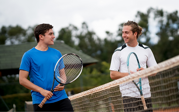 Image of two players talking over the net.