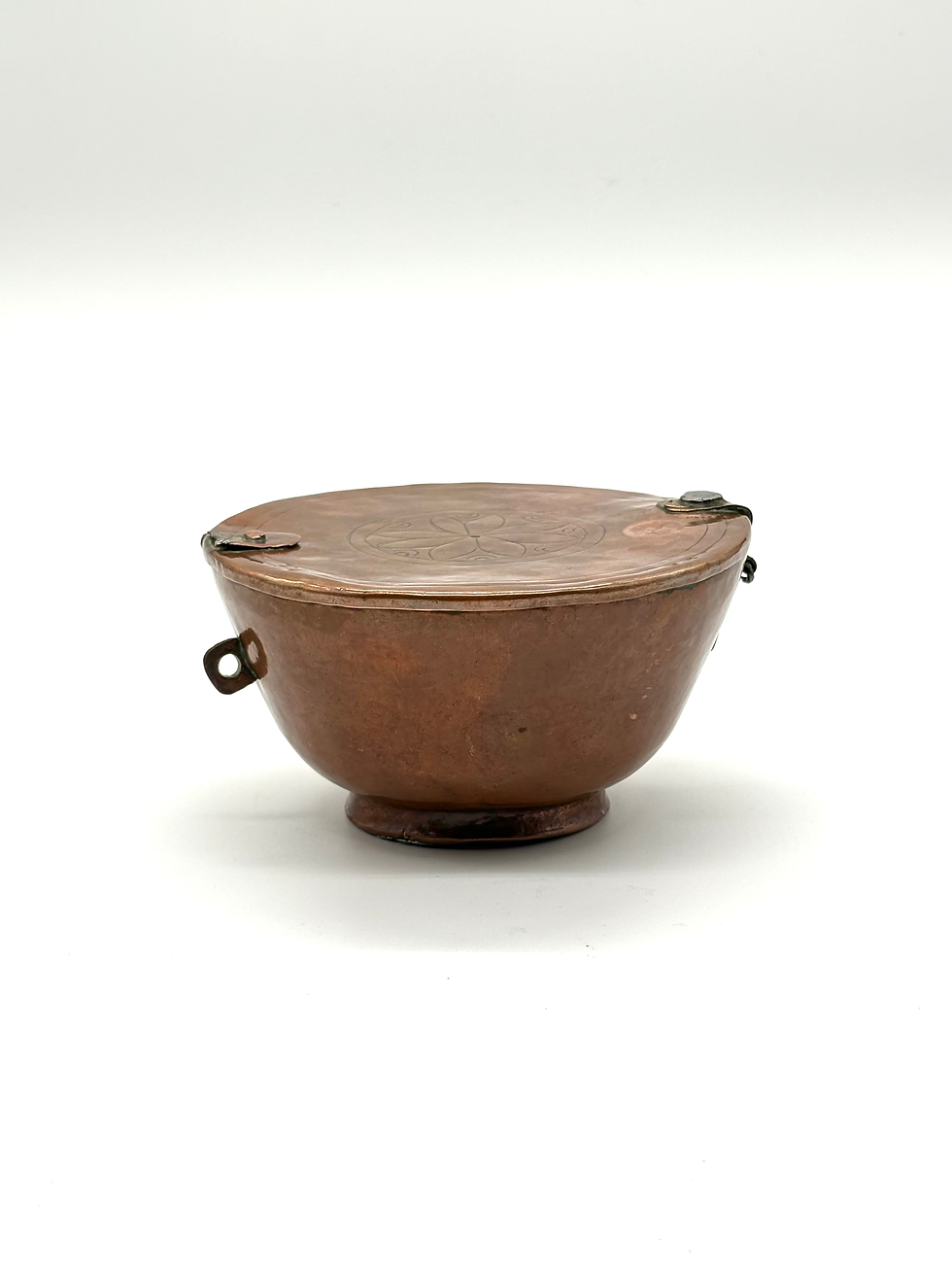 A late 19th century hand-beaten copper ice cream mould, side view