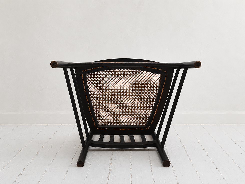 Thumbnail: Morris & Co for Liberty's: An elm latheback fireside chair, circa 1900, underneath view
