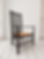 Morris & Co for Liberty's: An elm latheback fireside chair, circa 1900, angled view