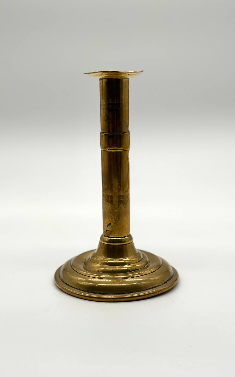 Thumbnail: A late 18th century brass ejector candlestick, back view