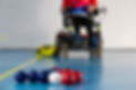 Boccia. A disabled sportsman sitting in a wheelchair. Close up of little balls for playing
