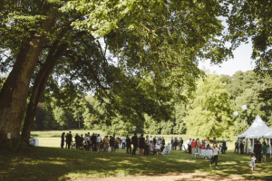 after wedding ceremony guests gathering in the park