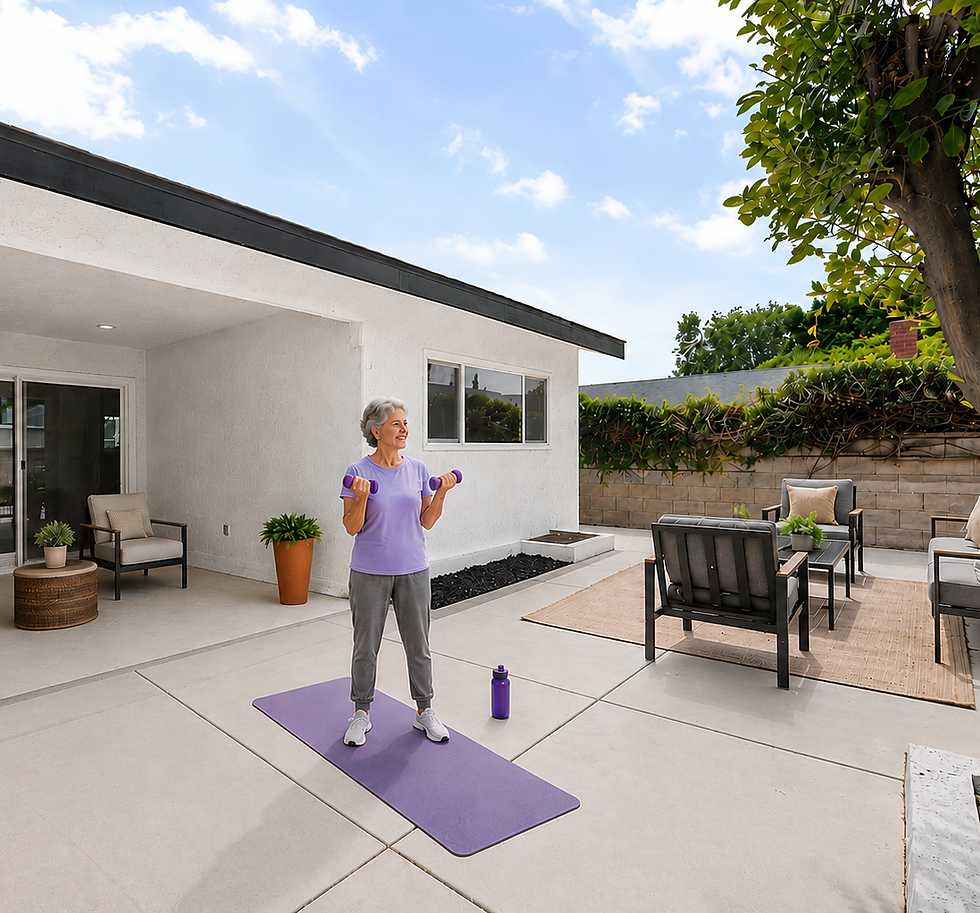 Older adult exercising with dumbbells on a patio in a senior living setting