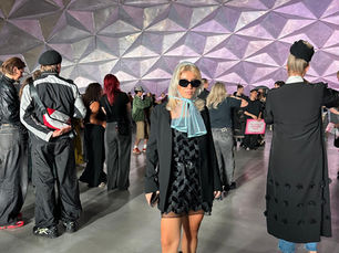 A woman wearing a transparent headpiece