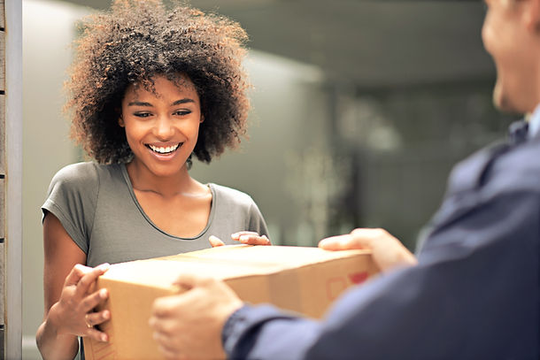 Black women accepting a pharmacy delivery from Health on South Rx.