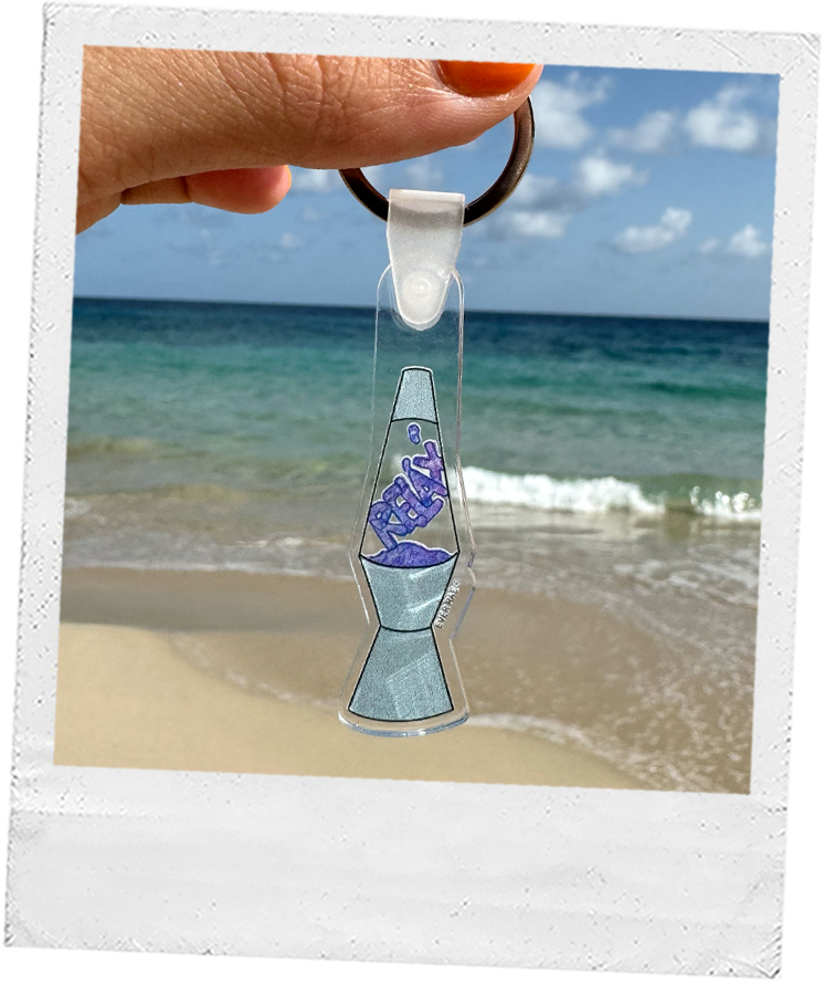 a hand holding a funky acrylic lava lamp keychain. purple lava lamp. watercolor art keychains. retro groovy "relax" keychain.