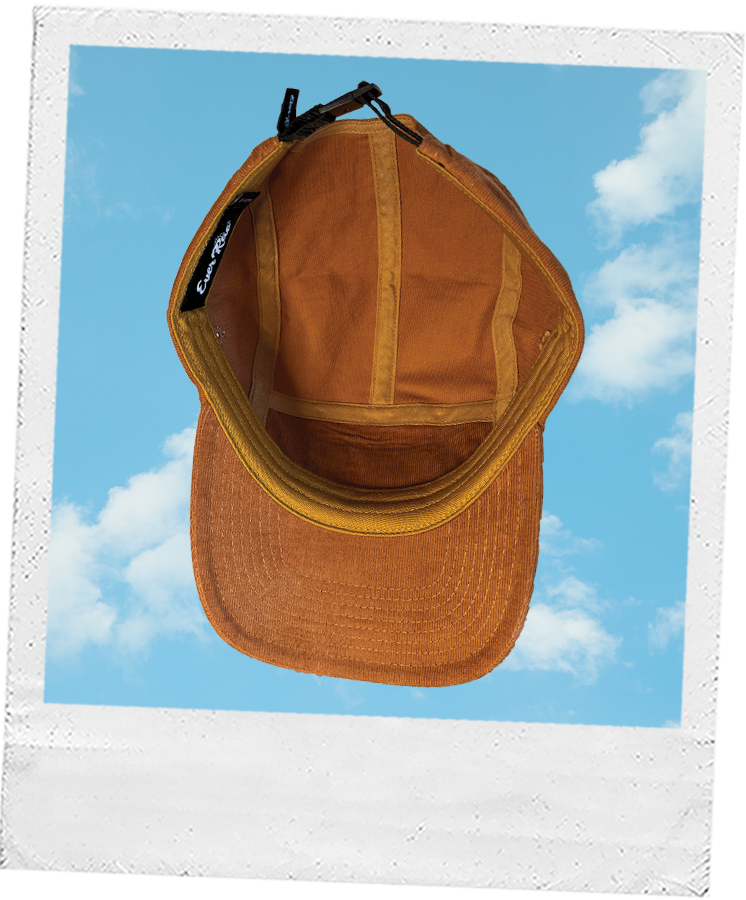Thumbnail: Soft brown-orange corduroy hat by Ever Rae, with a tan leather patch and relaxed sun and waves design