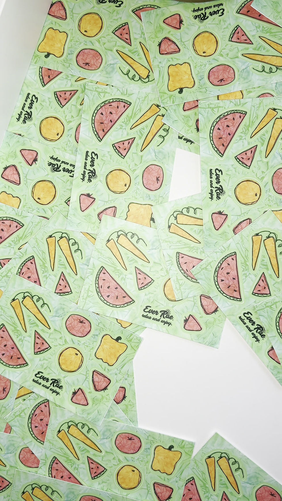 Thumbnail: POV point of view video showing the creation a good product shot of a veggies sticker sheet surrounded by other stickers