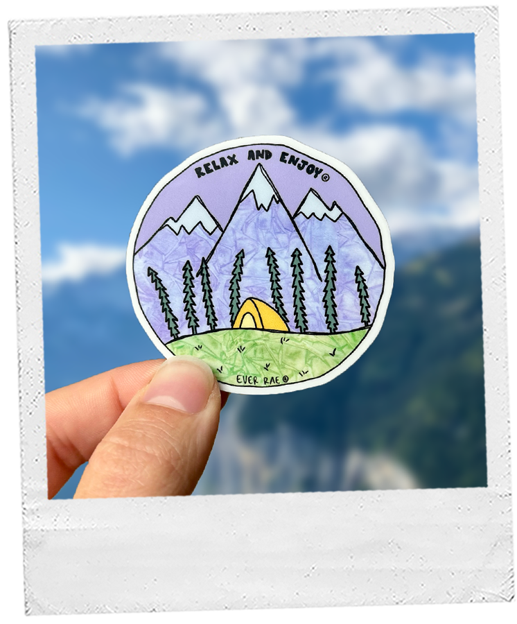 Thumbnail: sticker features a watercolor-style illustration of a tent on a grassy hill, surrounded by pine trees, with purple mountains