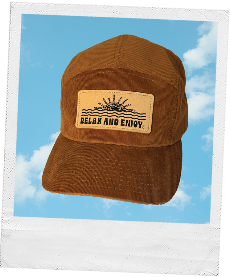 Thumbnail: Soft brown-orange corduroy hat by Ever Rae, with a tan leather patch and relaxed sun and waves design