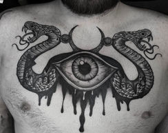 norse viking snake eye tattoo done at monstera ink tattoo studio east london