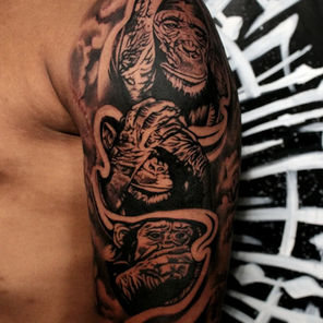 Blackwork chimp tattoo done in monstera ink tattoo studio romford