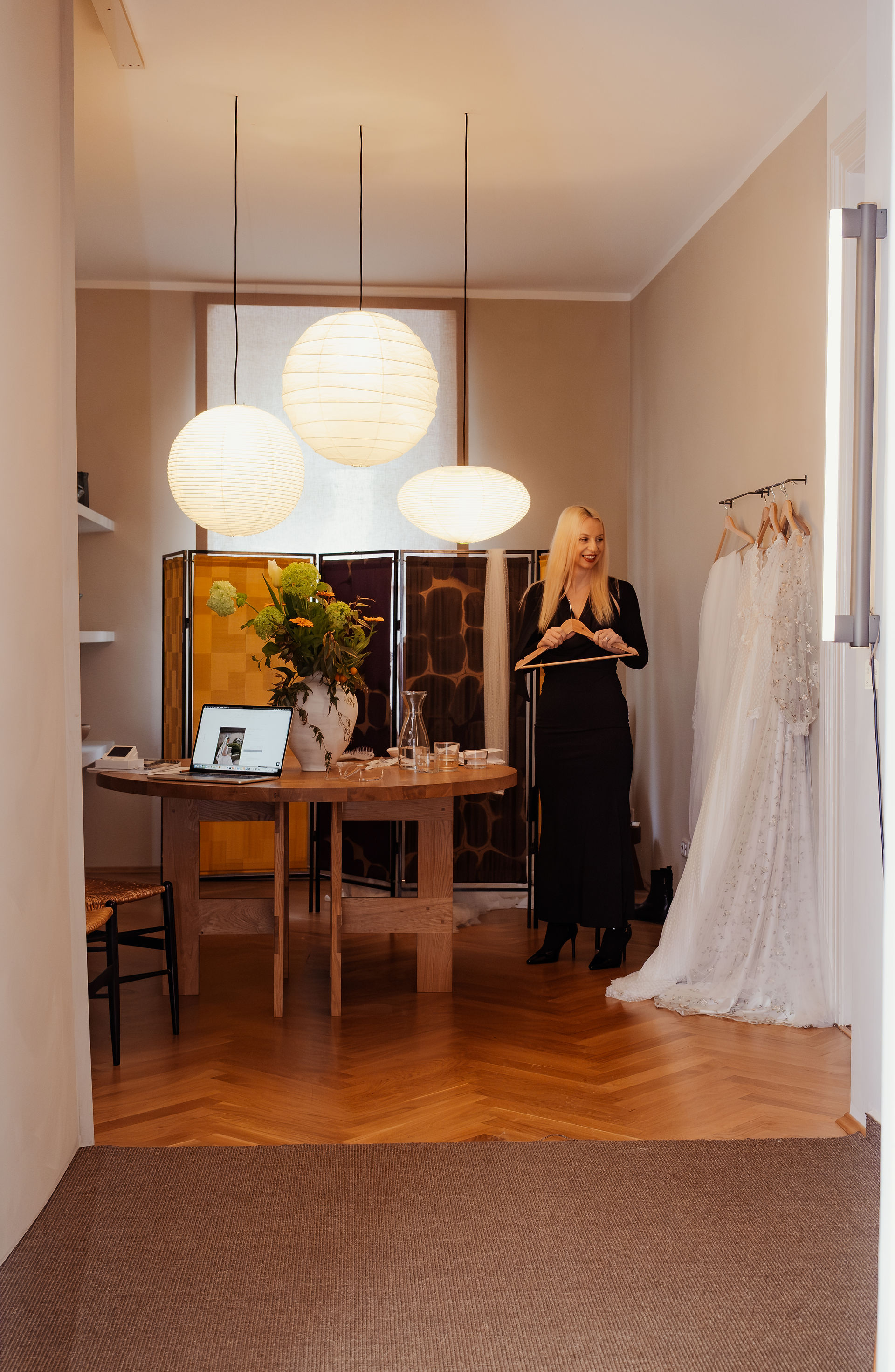 Amy Mair helping bride-to-be between dress changes