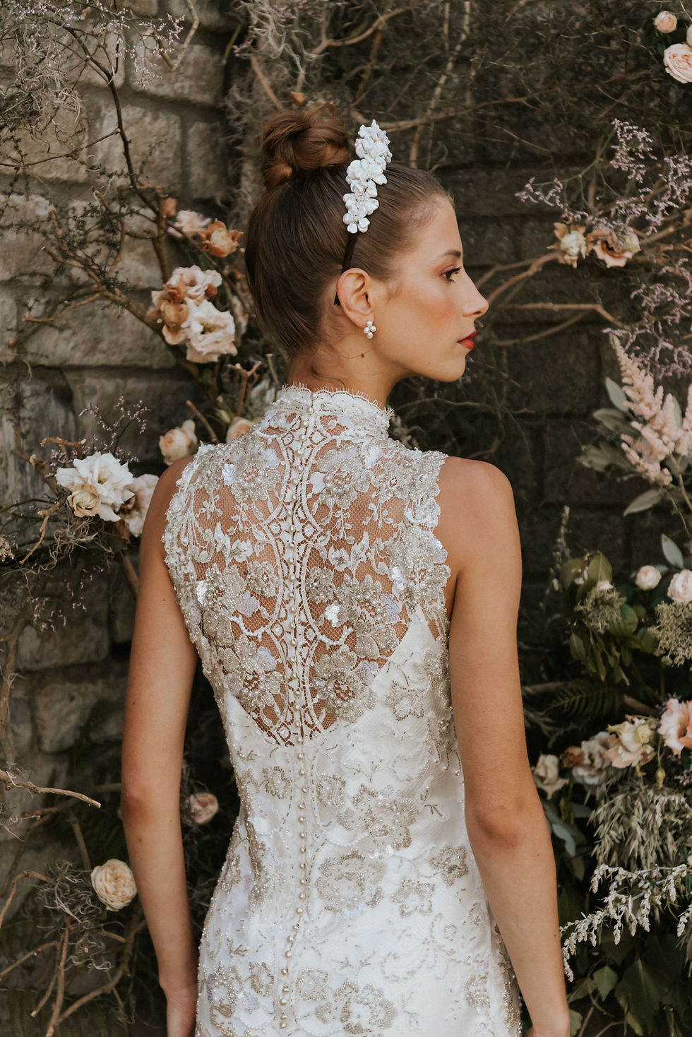 Miniatyrbild: Close up view of the back details of the metallic Lace wedding dress