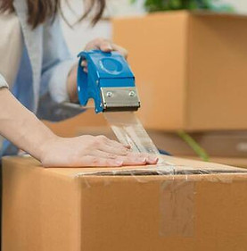 focus-hand-of-owner-business-asian-woman-female-holding-packing-box-by-tape-machine-sealin