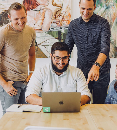 Design review in startup office with mac
