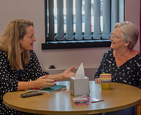 Wayfinder and customer at a table at Sage House_edited.jpg