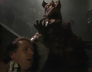 The Caves of Androzani review: The Fifth Doctor, played by Peter Davison, hides from the cave beast