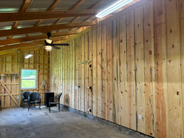 Completed barn structure in Mountain Grove, showcasing the transformation from foundation to a finished building with a functional interior.