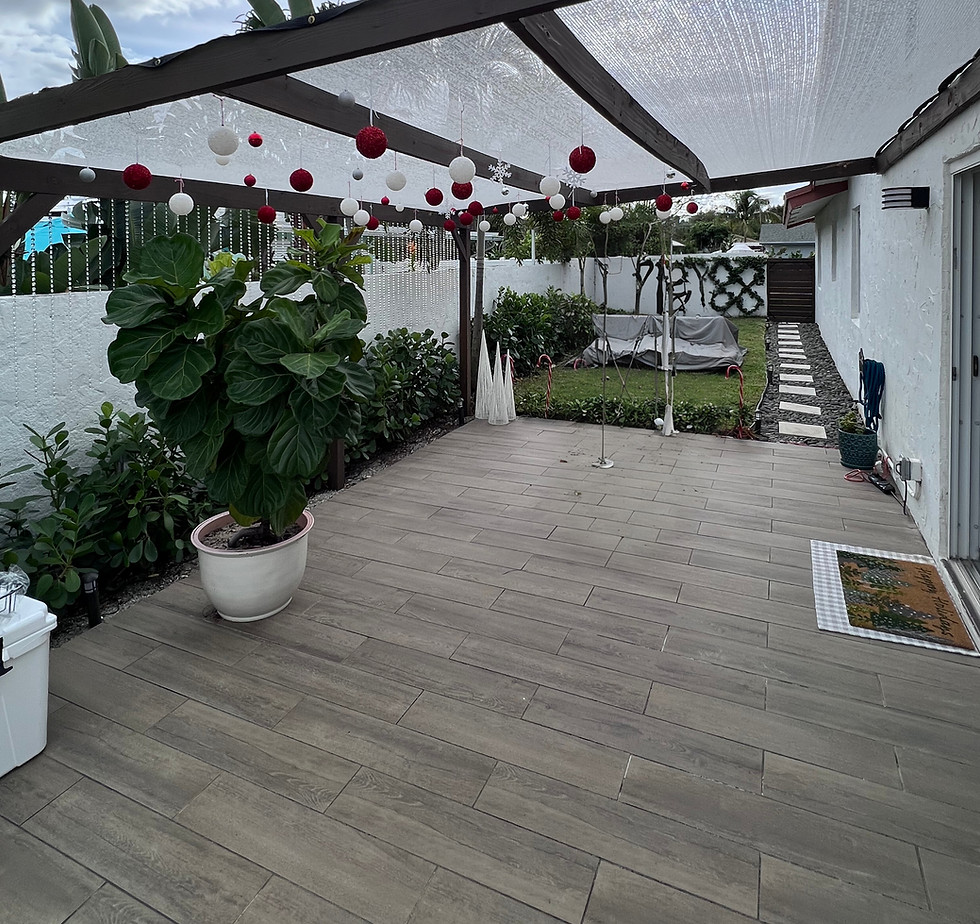 Patio remodel with new tile, pergola, and shade cloth.