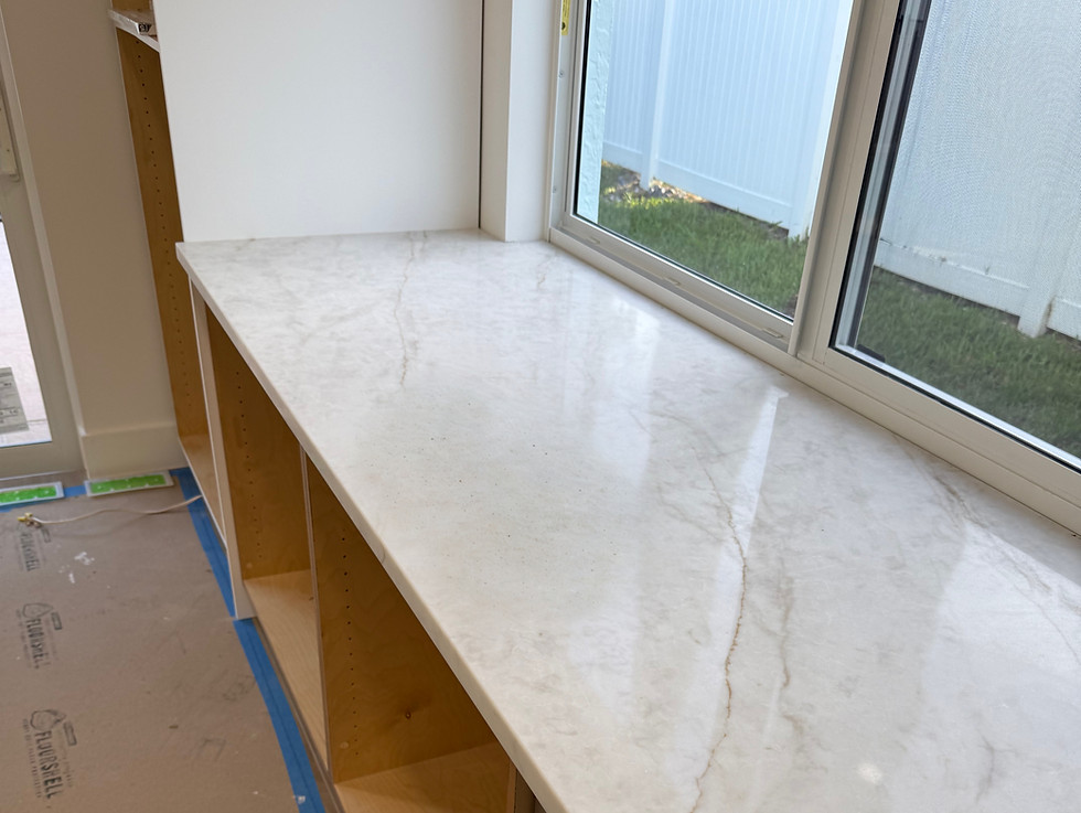Modern new kitchen bar area renovation with Taj Mahal quartz countertops