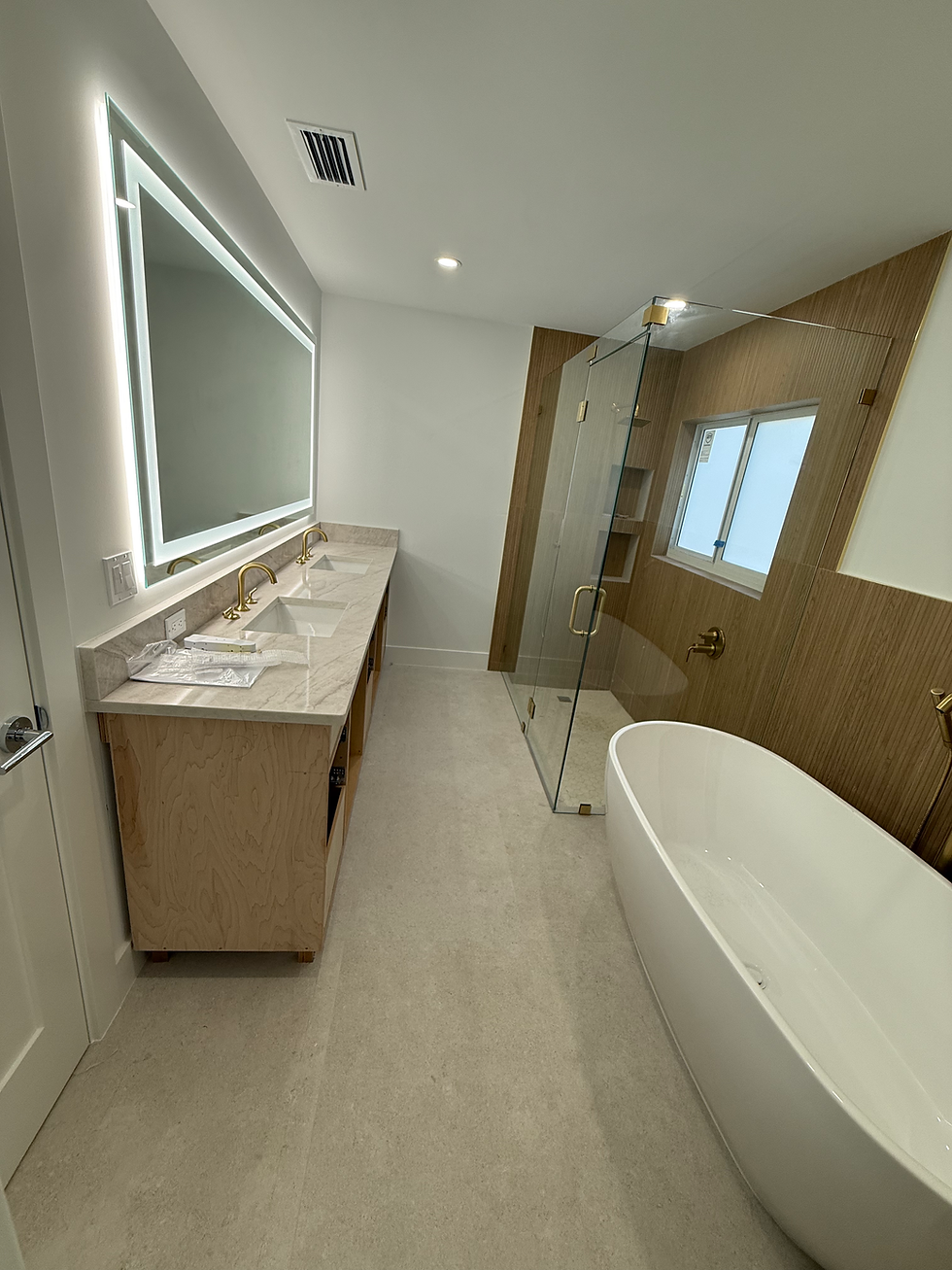 Modern bathroom by residential construction services.