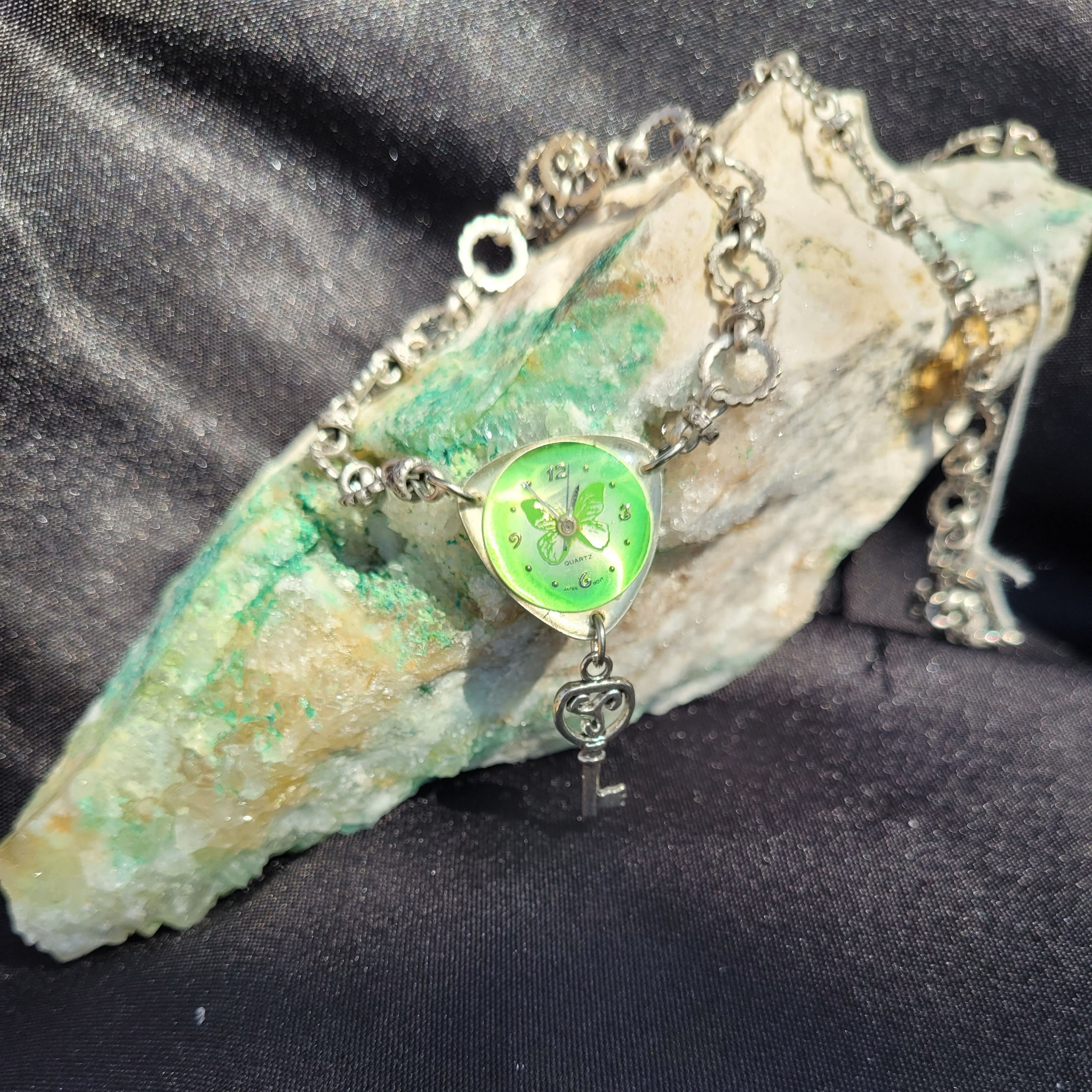 Green Watch Face with Silver Key dangle on Pendant on Gray Metal Chain