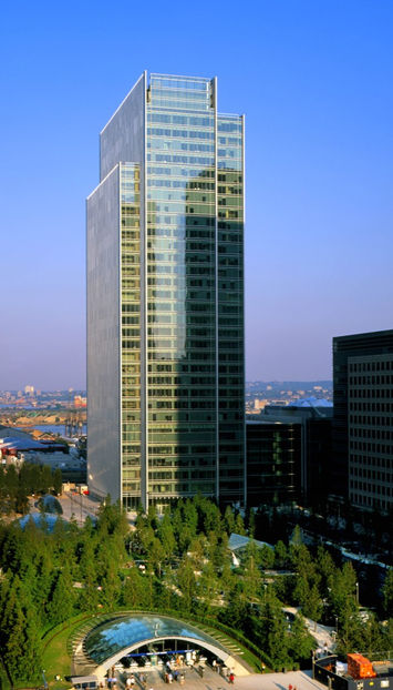 Tall skyscraper daytime view, Commercial Real Estate Projects, with blue sky background.