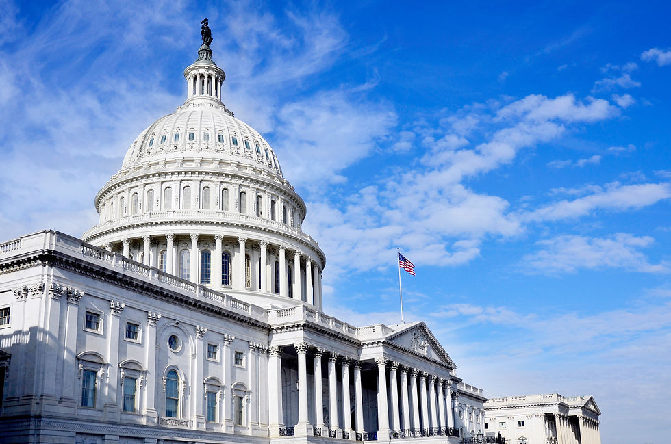 U.S. Capitol with blue sky and white clouds