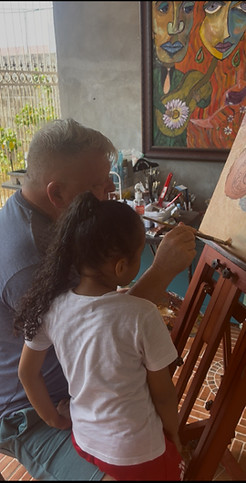 Stephen Harrelson teaching art to a young girl in Honduras.