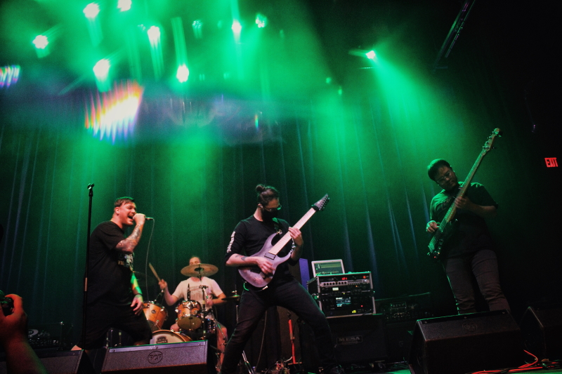 Photo of the Manitoba metalcore band Planeshifter, performing on The Park Theatre stage.