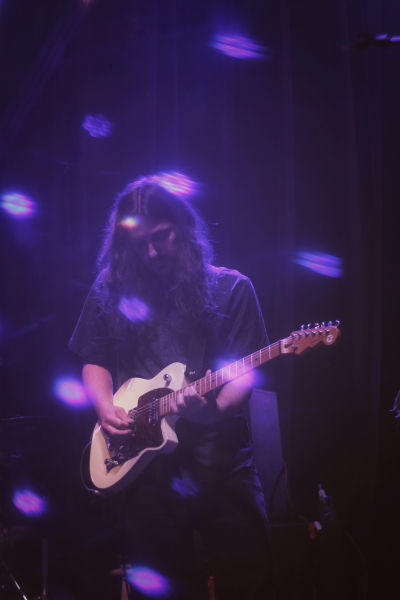 Photo of the Manitoba indie pop artist Lana Winterhalt performing on The Park Theatre stage.