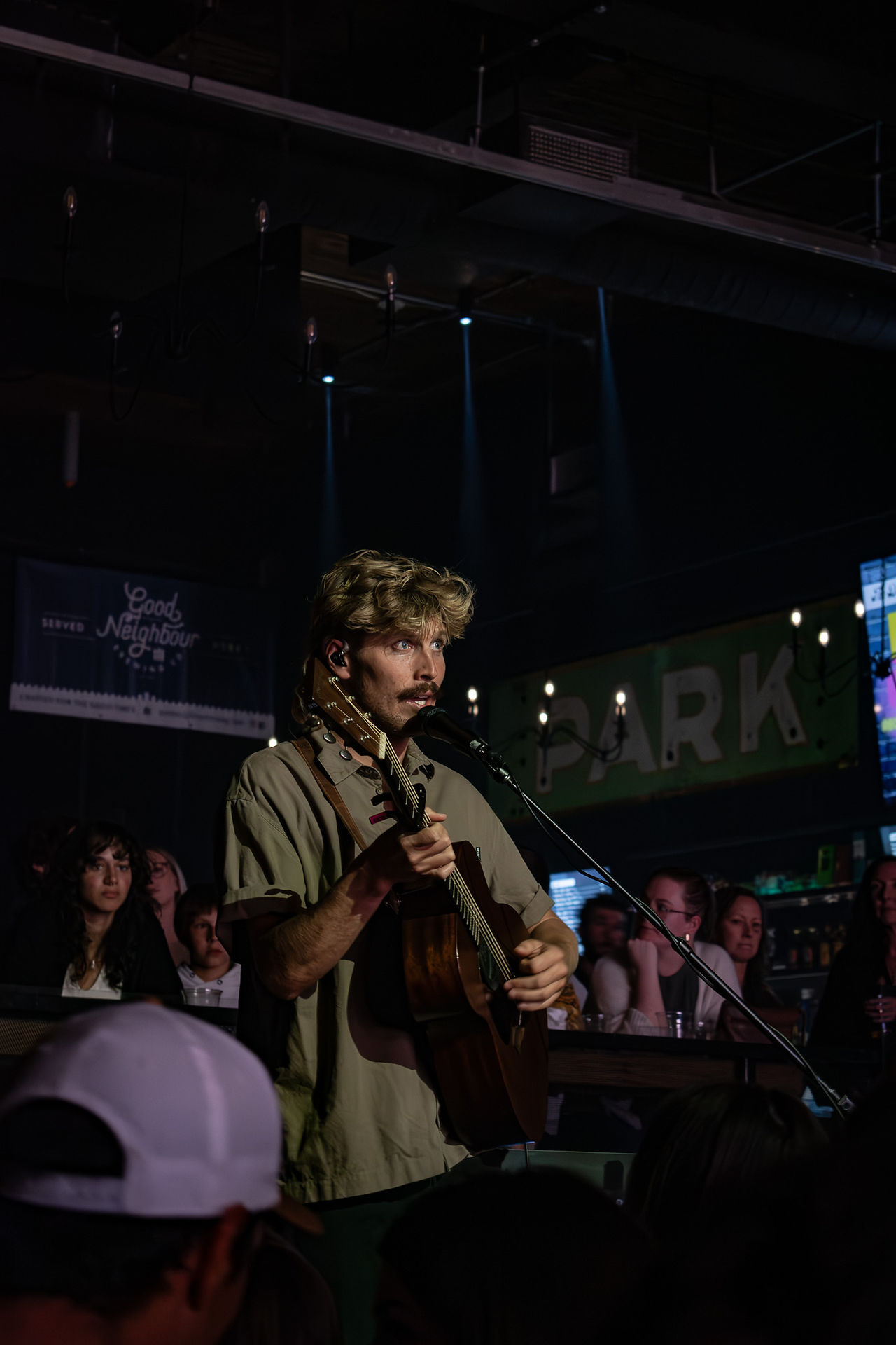 Ziggy Alberts performing a pop-up show in Winnipeg on the Park Theatre stage.