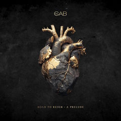 A heart sculpture with gold accents sits on a dark background. Text reads "THE CAB" above and "ROAD TO REIGN: A PRELUDE" below.