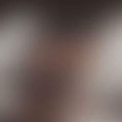 Two guitarists perform energetically on a foggy stage, lit by spotlights. A neon sign and partial "James Band" text are visible in the background.