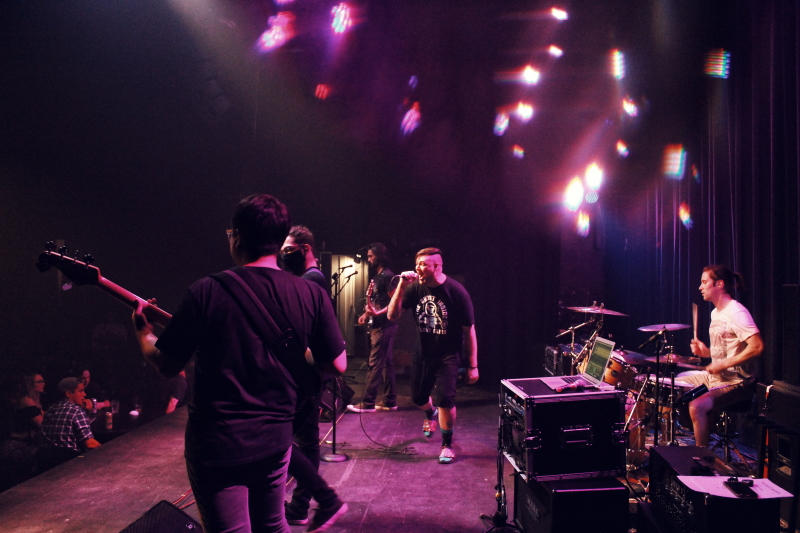 Photo of the Manitoba metalcore band Planeshifter, performing on The Park Theatre stage.